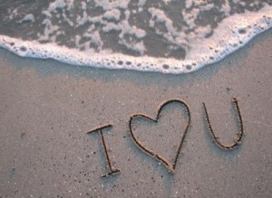 Love text on sand